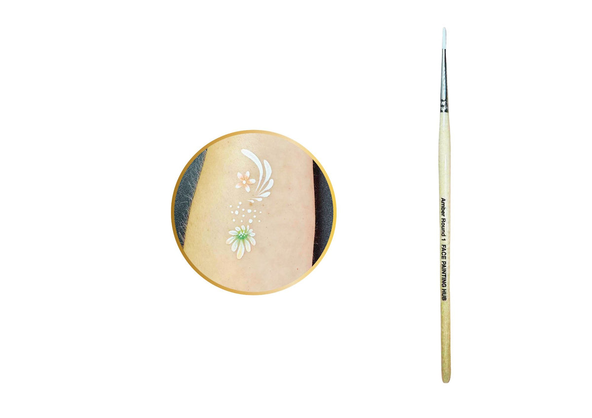 A fine-detail paint brush shown vertically next to a circular inset demonstrating a floral temporary tattoo design applied to skin.